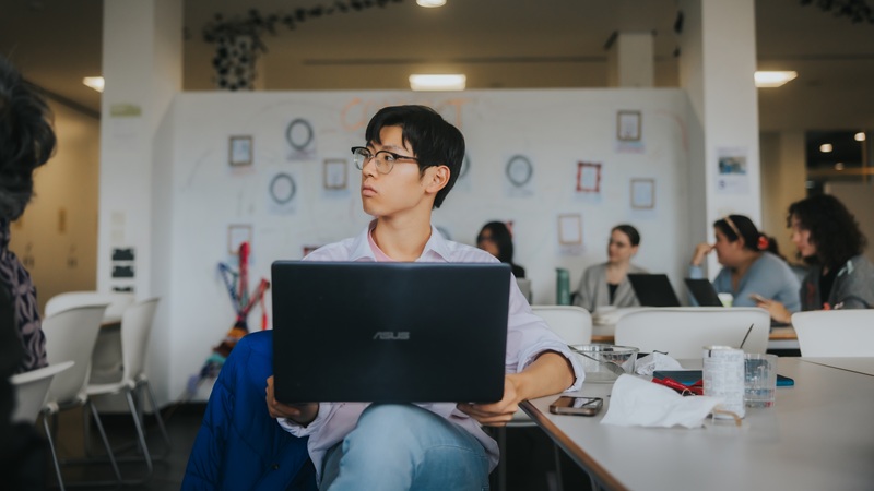 Student sitting with their laptop