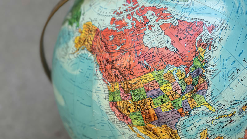 Detailed globe of North America highlighting countries and regions.