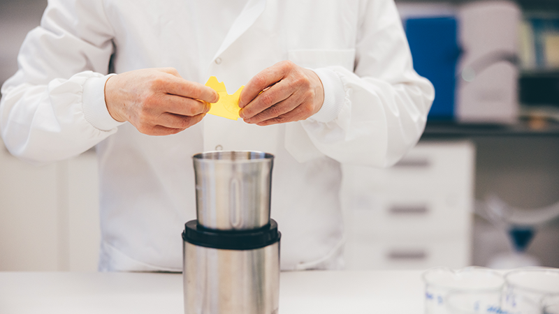 Performing scientific experiments in a lab.