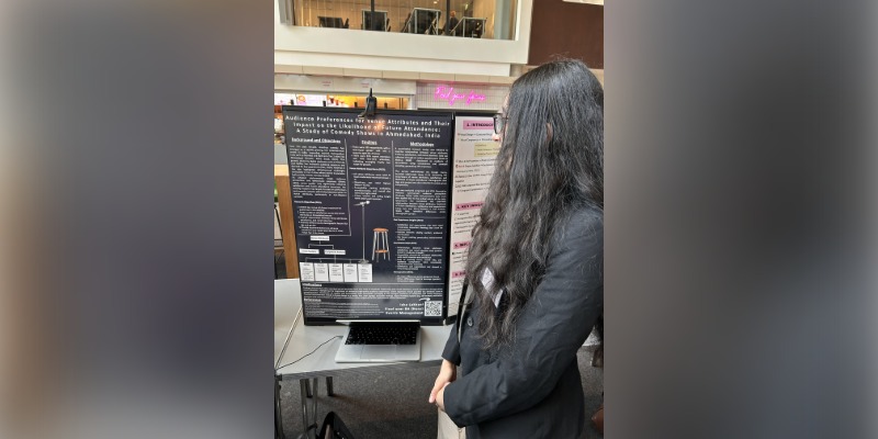Isha Lakhani with their poster