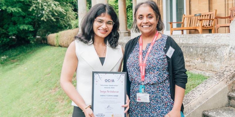 Sonia Porthukaran receives a highly commended certificate from Volunteer Coordinator Maya Patel