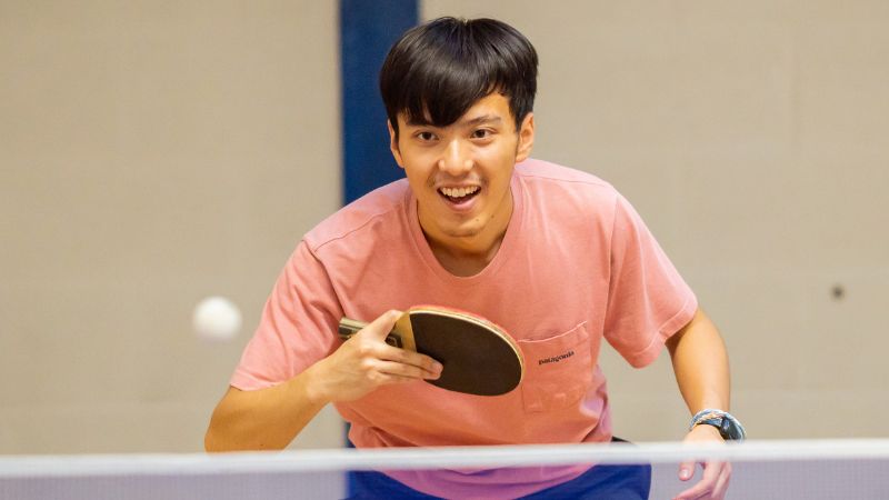 Student playing table tennis