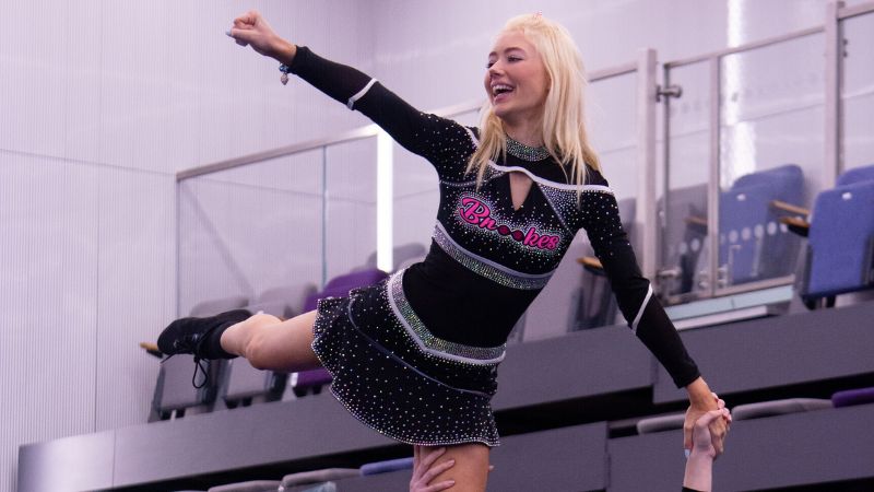 Cheerleaders performing a stunt 