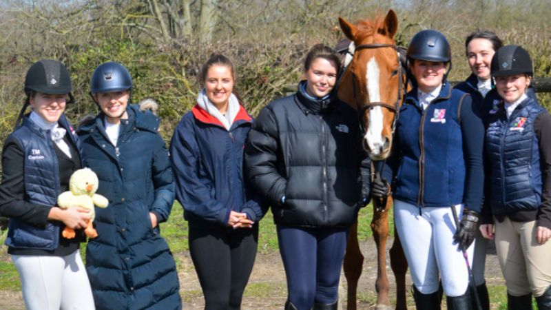 Equestrian team with horse 