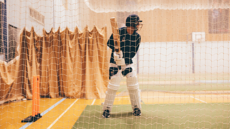 Cricketer using the indoor cricket nets 