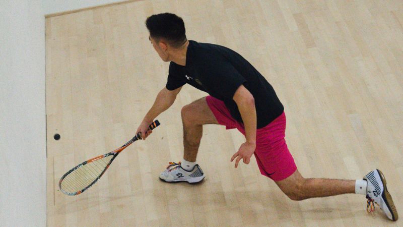 Squash player playing squash