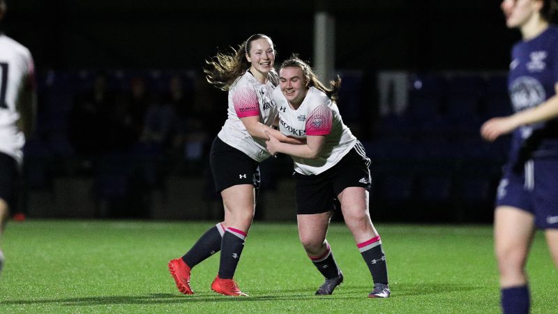 Women's Football players celebrating