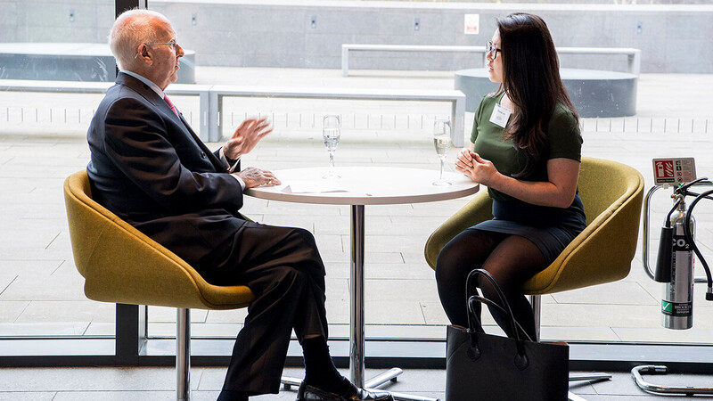 A man and woman in a meeting