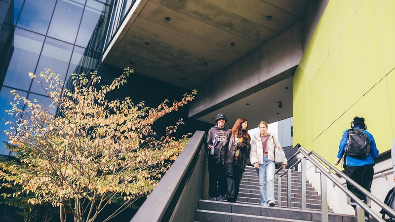 Students walking down the stairs at Headington Campus