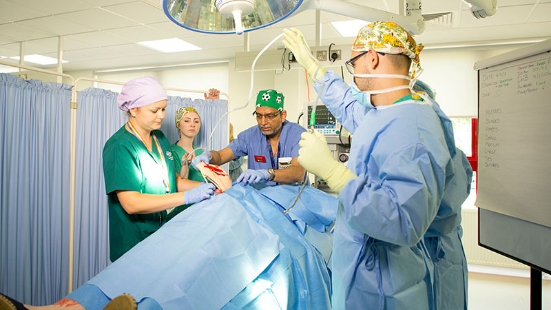 healthcare professionals attending to cardiac patient 
