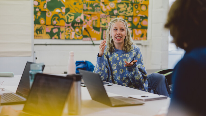 Teaching students discussing their learning