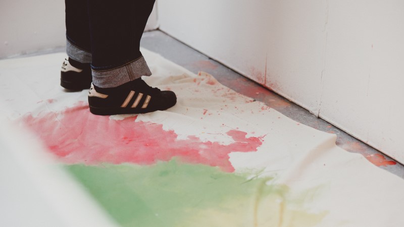 Abstract image of students' footwear while painting