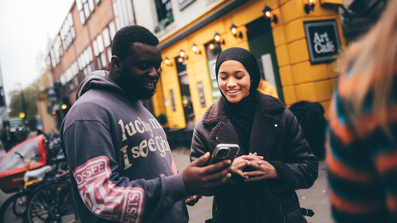 Students in Oxford looking their smart phones