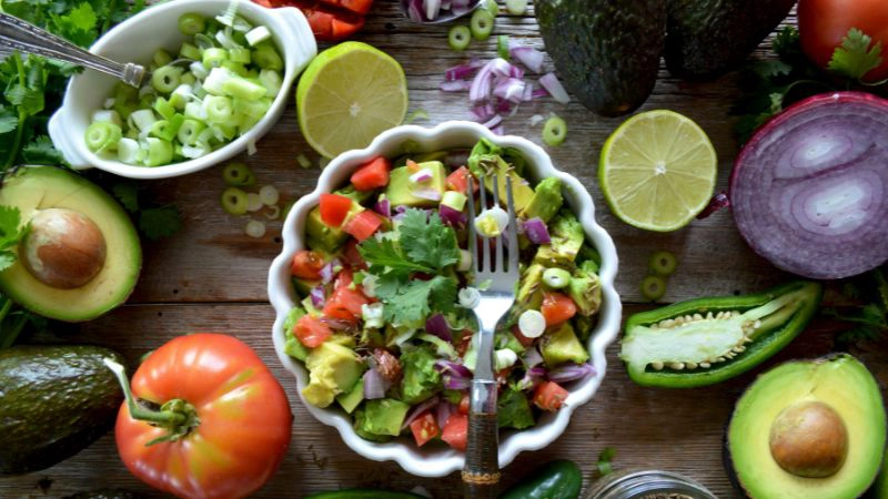 healthy vegetables in bowls on a table top
