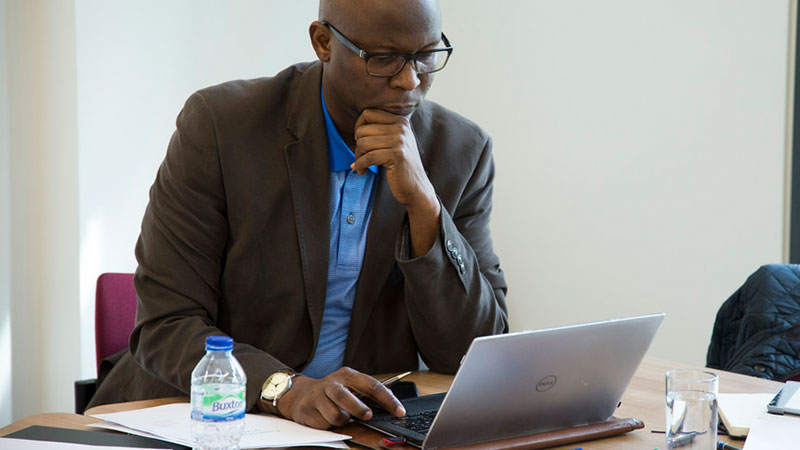 Student typing on computer