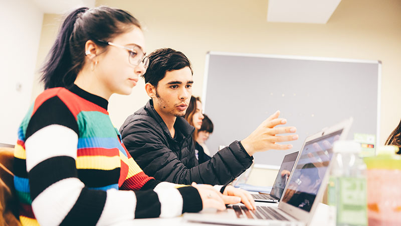 Students working on laptops