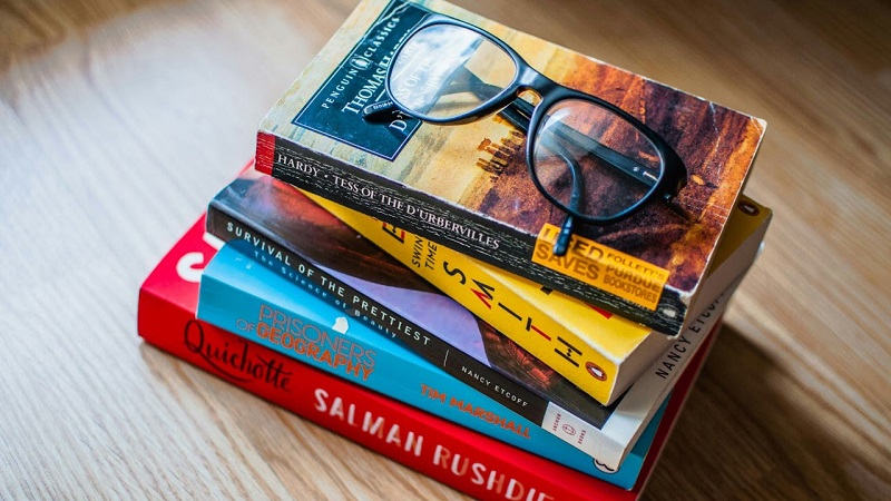 Stack of novels on a table