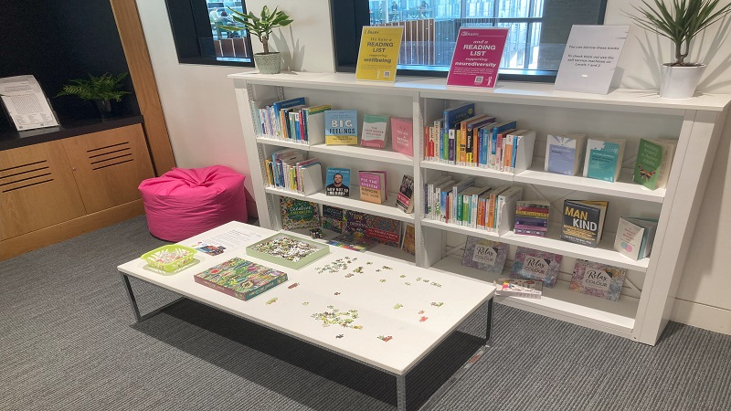 Headington Library JHBB wellbeing space with books, jigsaws, beanbag seating
