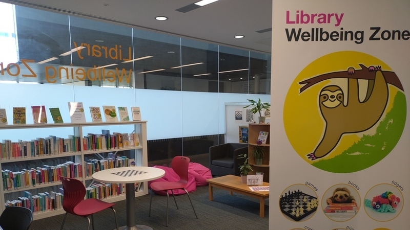 Headington Library JHBB wellbeing space with books, chess table, beanbag seating