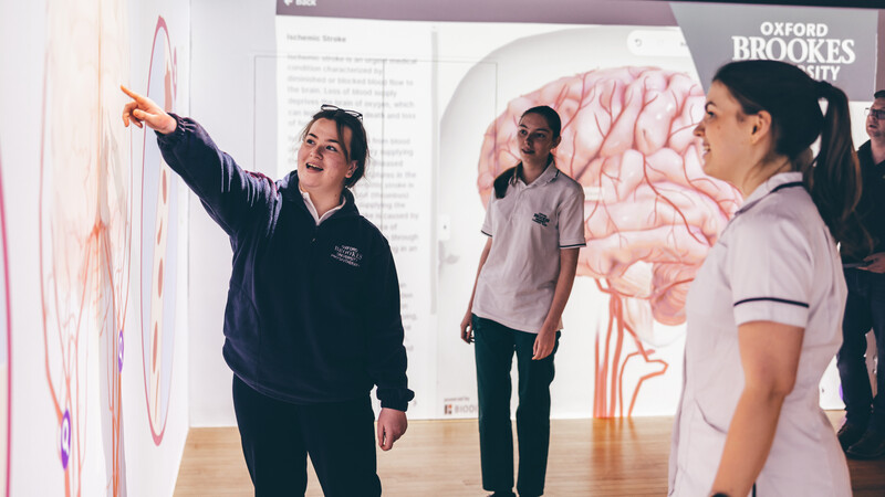 Students looking at projections on a wall