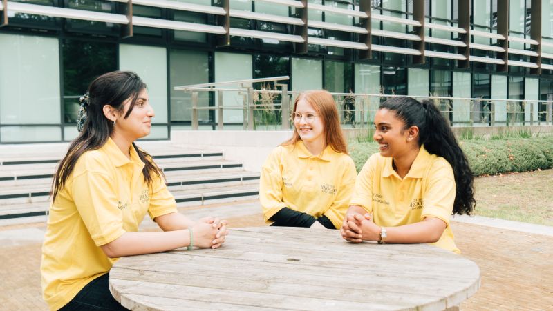 Three Student ambassadors stood together talking