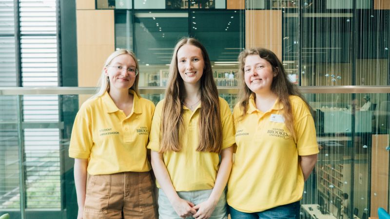 Two Student Ambassadors at a help desk