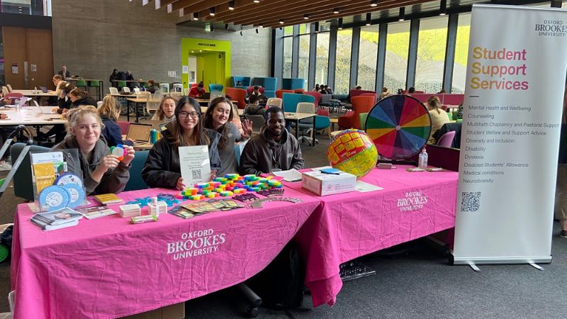 Student Community Wardens at a safety event stall in the Forum, Headington Campus