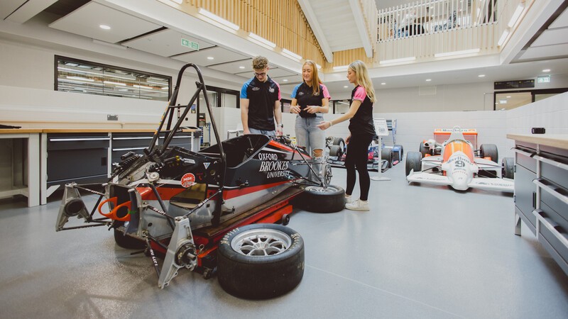 Undergraduate Mechanical Engineering and Motorsport in the new NHHB: students working on a racing car in the motorsport lab
