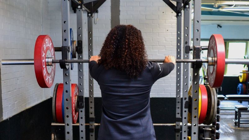 Student setting up to squat 
