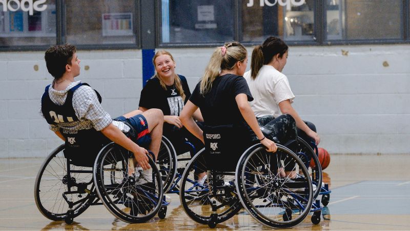 Students playing wheelchair Basketball