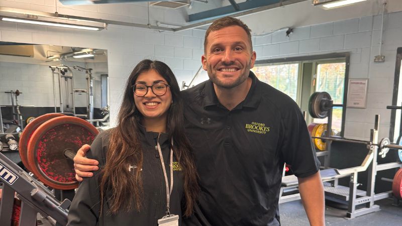 Two staff members in the gym