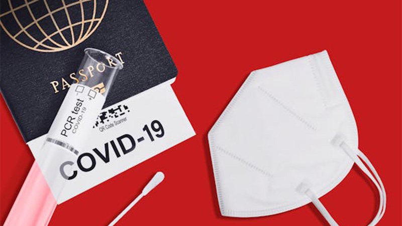 Image of COVID passport and face mask.