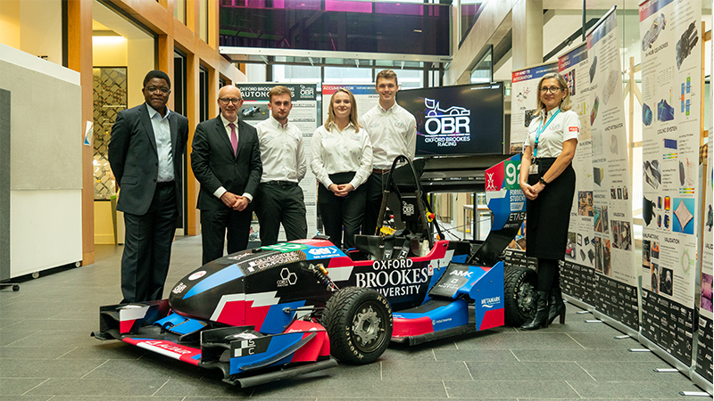 An image of Tessa Waldron accompanied by staff and students from the University, and also Matt Western MP, Shadow Higher Education Minister