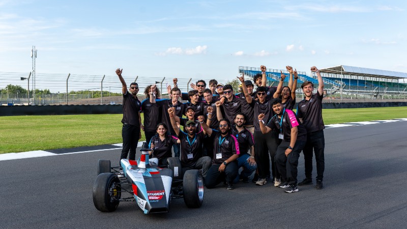 OBR Autonomous team with the self-driving car on the track at Silverstone. 