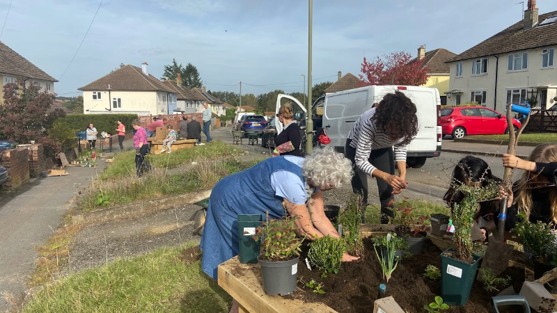 People gardening in a street