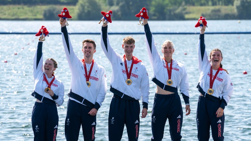 The PR3 Mixed Coxed four crew with their gold medals.