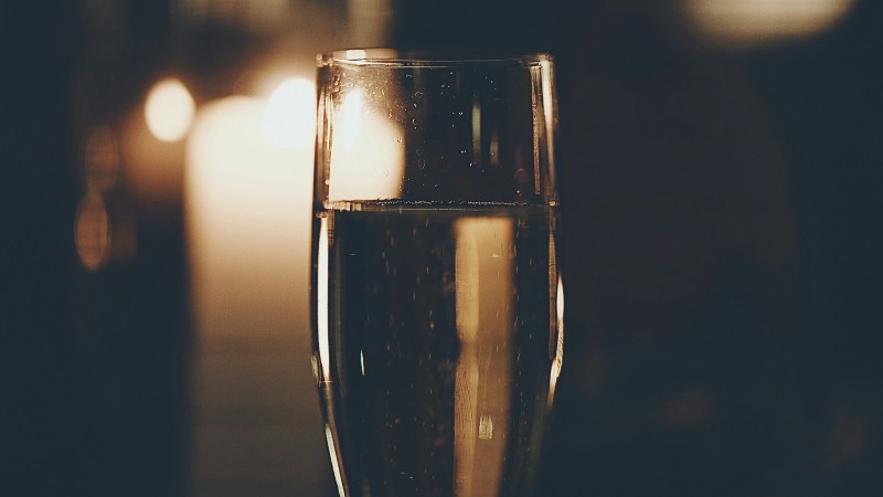 An image depicting a glass of alcohol 