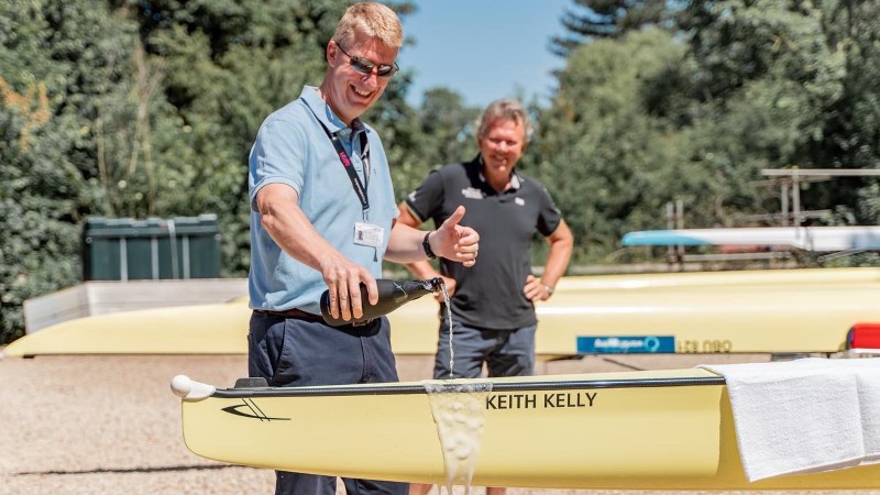 Keith Kelly pictured in 2023 with a boat named after him