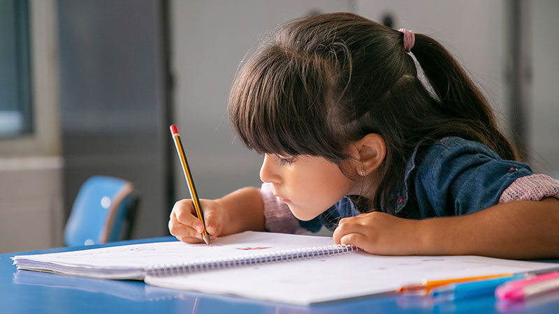 A young child writing