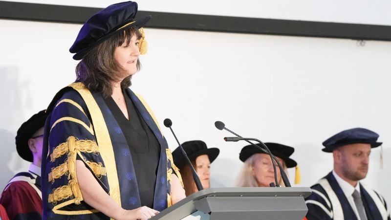 Prof Helen Laville at the lecturn