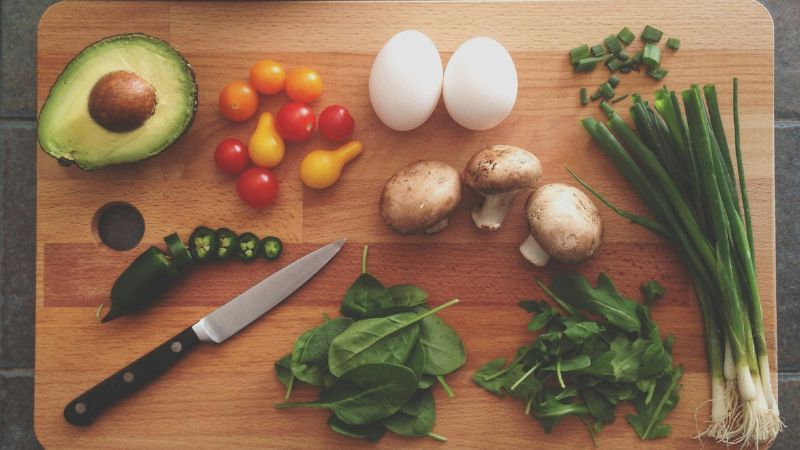 vegetables and eggs on a chopping board