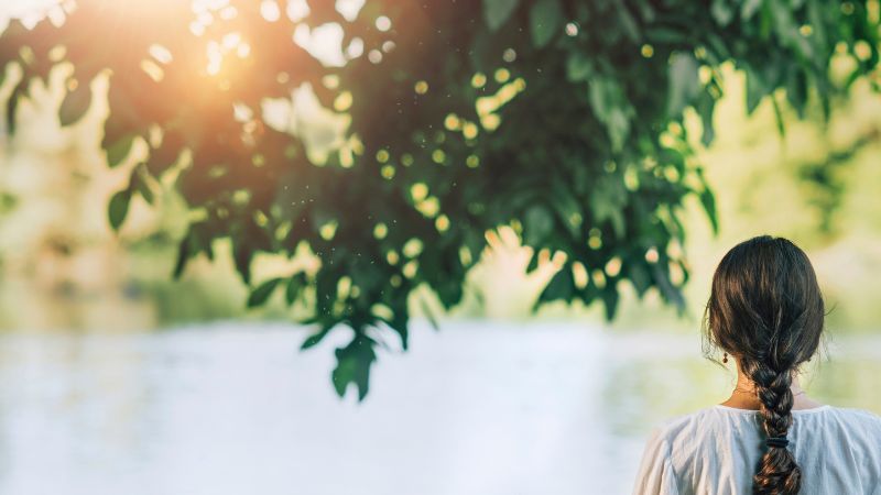 woman looking over a lake
