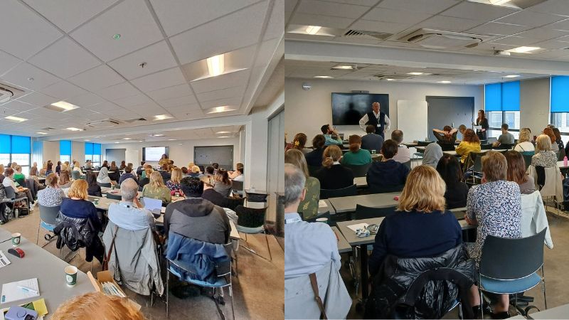 people listening to speakers speak at the Oxford Institute for Applied Health Research Symposium