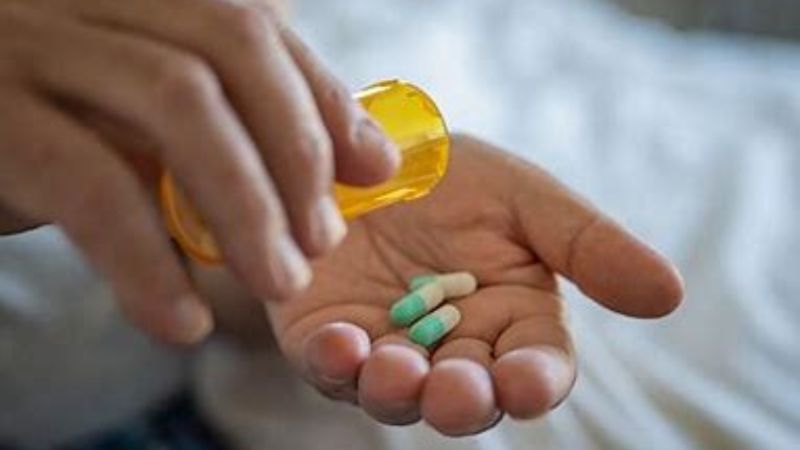 pills being poured in a palm