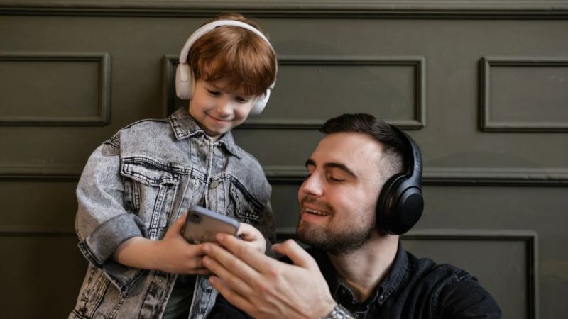 Man and boy listening to music