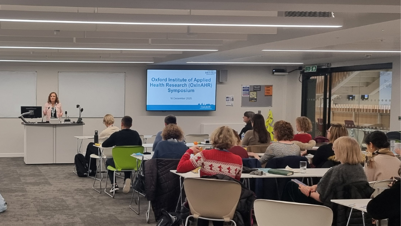 Prof Benita Oliver presenting presenting at the OxInAHR Symposium 2025.