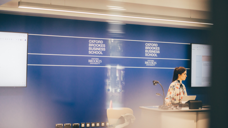 A lecturer teaching a class in Oxford Brookes Business School.