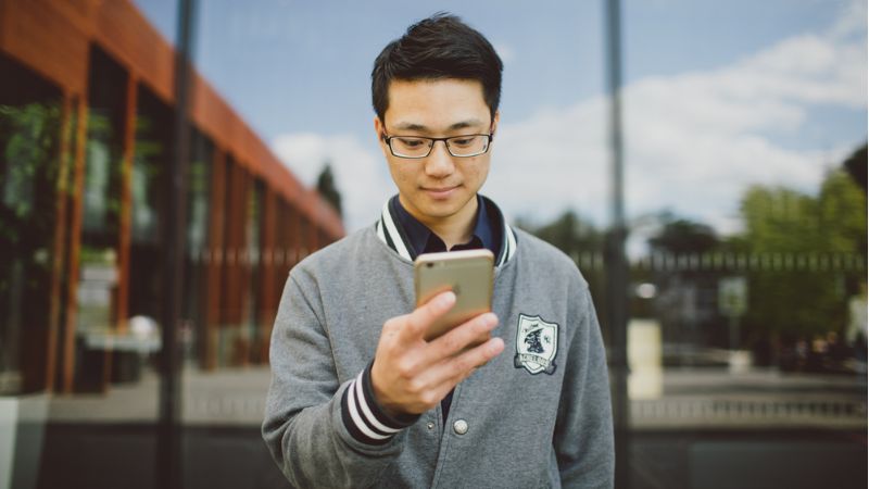 A student using their mobile phone.