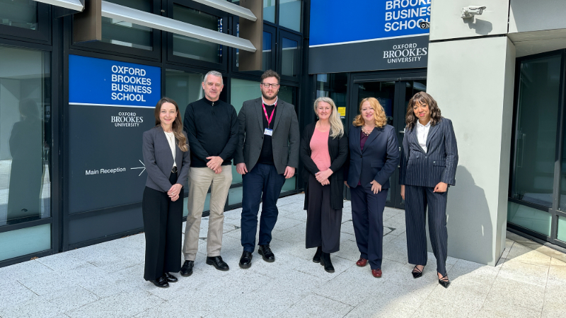 A group of people outside Oxford Brookes Business School