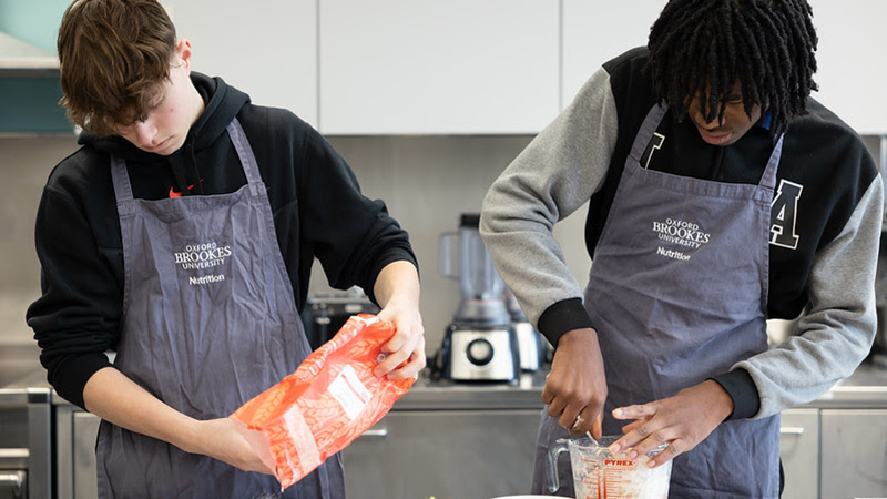 oxford brookes students at a workshop baking